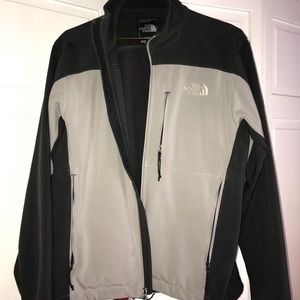 The north face jacket. Dark gray and light gray
